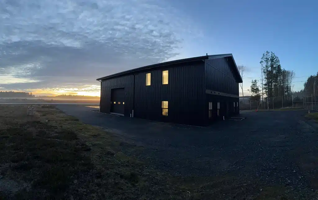 A black post-frame hangar