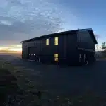 A black post-frame hangar