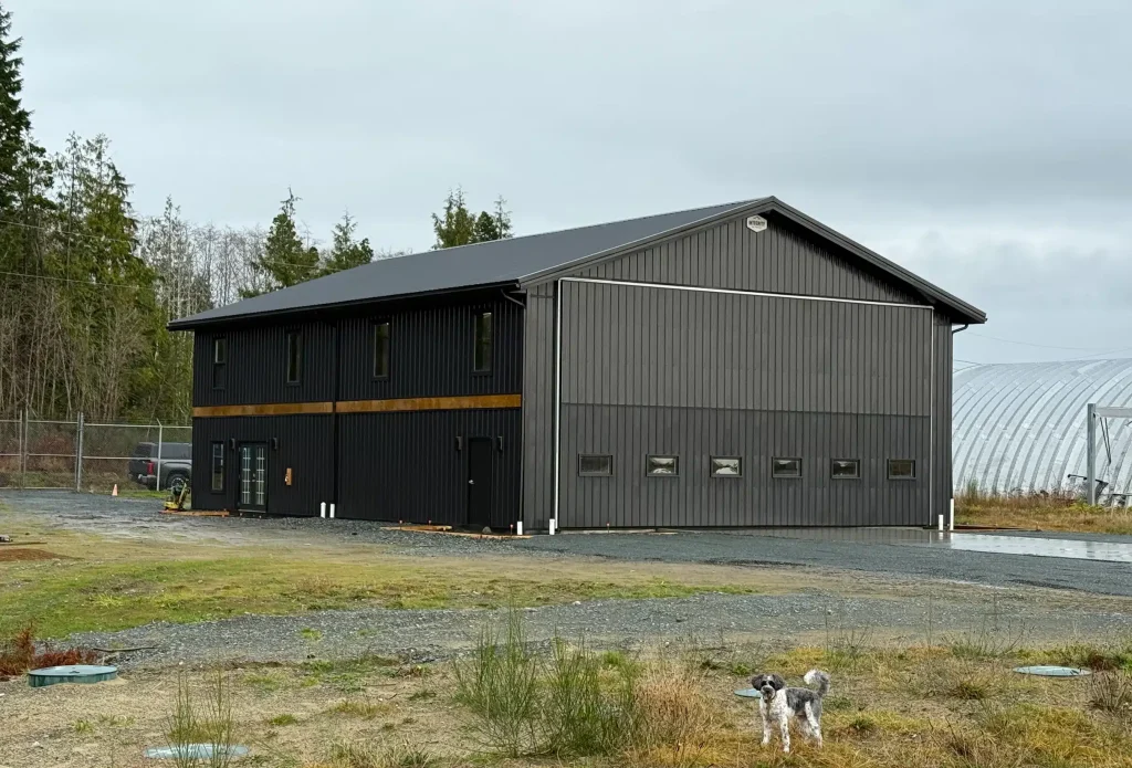 A black post-frame hangar