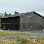 A black post-frame hangar