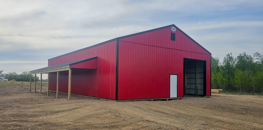 A bright red post-frame agricultural shop