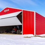 red post-frame machine shed by Integrity post structures