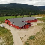 A post-frame equestrian riding arena