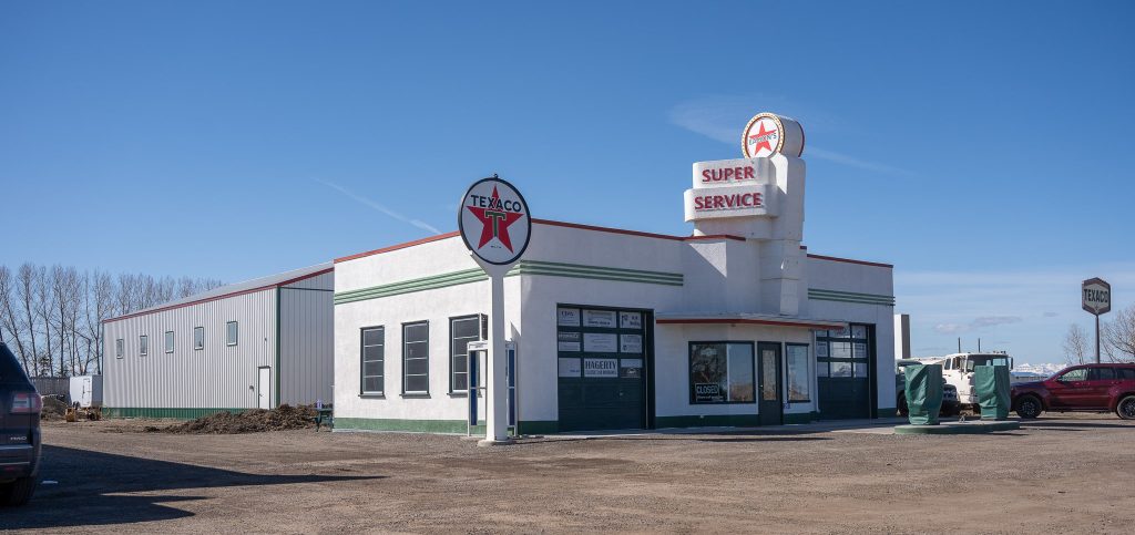 A white white post-frame Agricultural shop and museum.