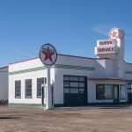 A white white post-frame Agricultural shop and museum.