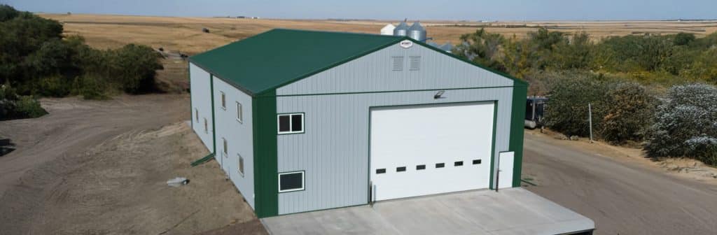 A post-frame agricultural shop with overhead door
