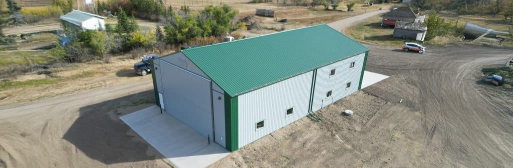 A post-frame agricultural shop with overhead door