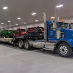 A white white post-frame agricultural machine Shed