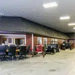 A white white post-frame agricultural machine Shed