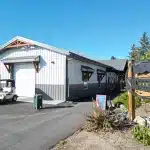 A white white post-frame commercial golf cart storage