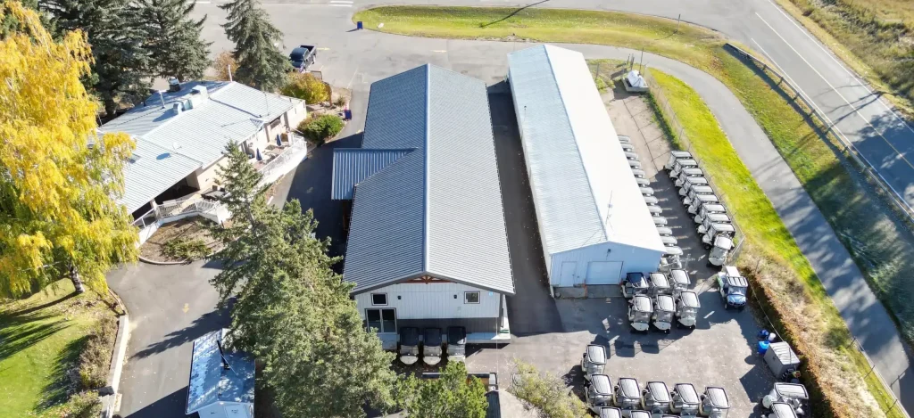 A white white post-frame commercial golf cart storage