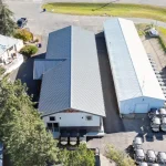 A white white post-frame commercial golf cart storage