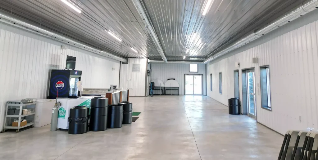 A white white post-frame commercial golf cart storage