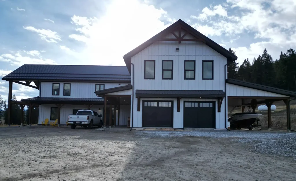 Front view of a white white post-frame barndominium