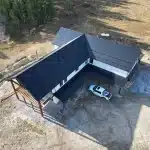 Overhead view of a white white post-frame barndominium