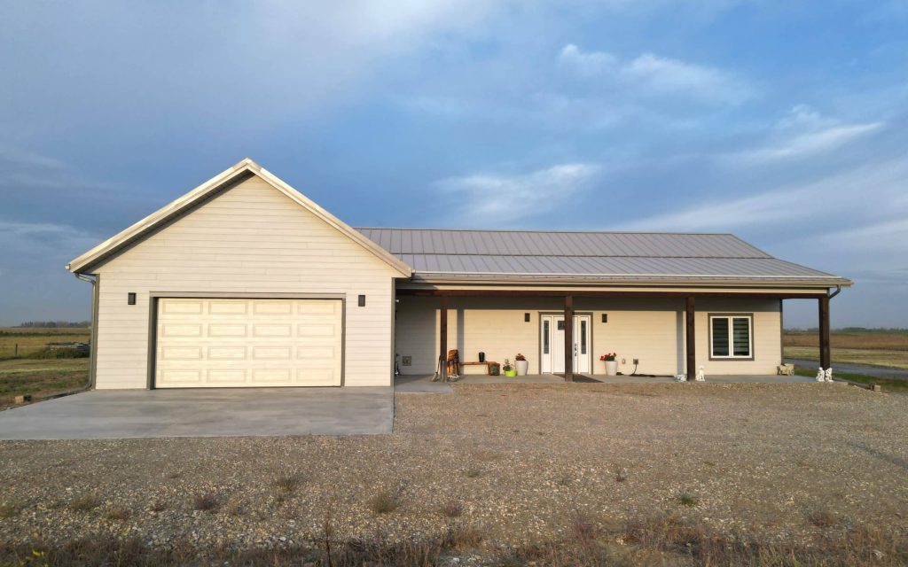 A galvanized post-frame highwood with garage