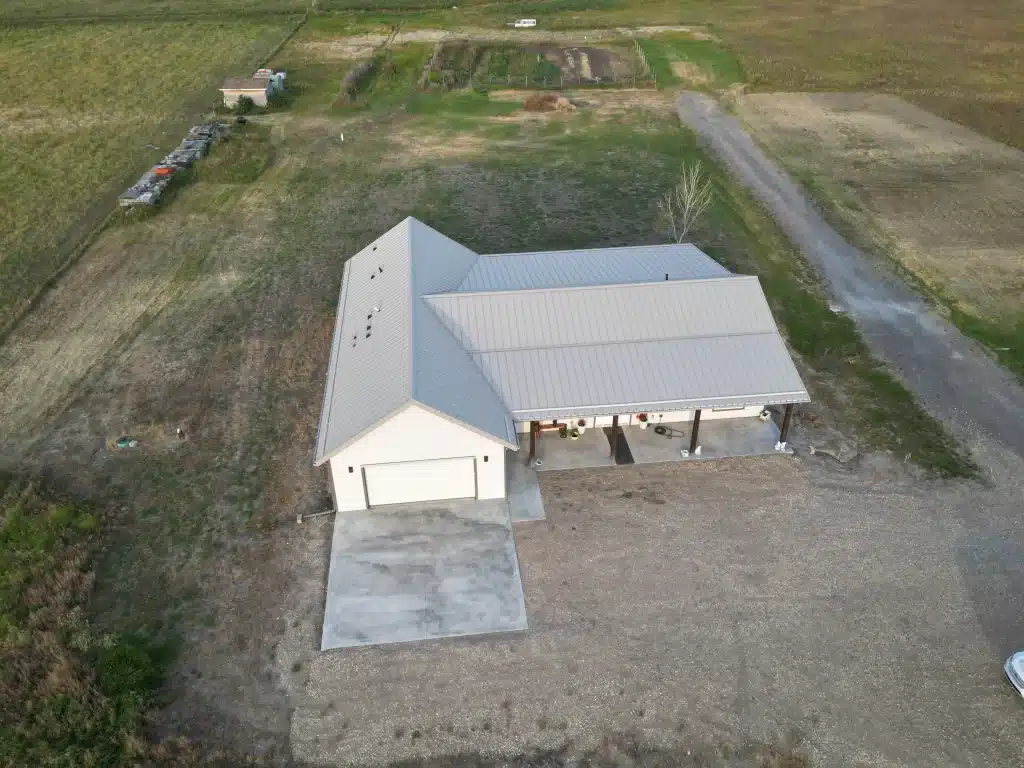 A galvanized post-frame highwood with garage