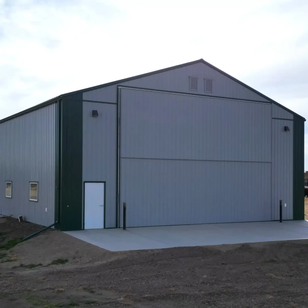 A post-frame agricultural shop with bi-fold door
