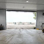 A post-frame agricultural shop