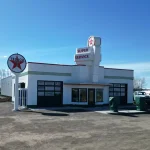 A white white post-frame Agricultural shop and museum.