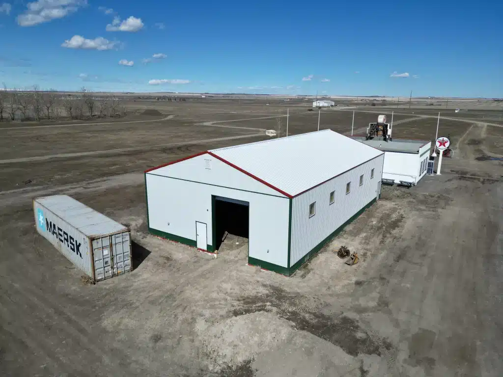 A white white post-frame Agricultural shop and museum.