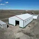 A white white post-frame Agricultural shop and museum.