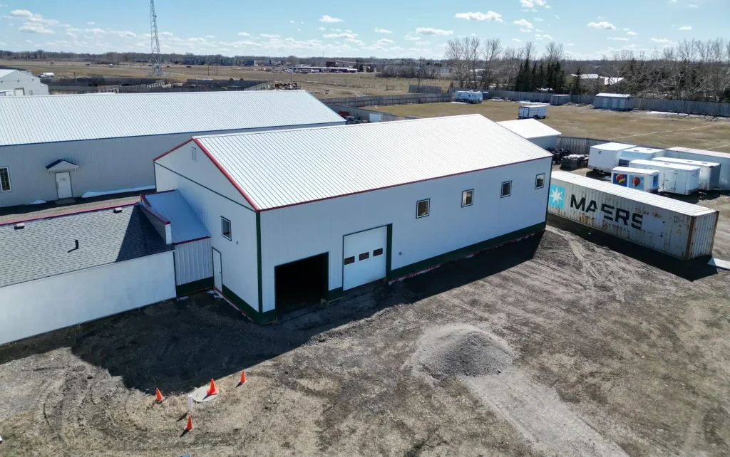 A white white post-frame Agricultural shop and museum.