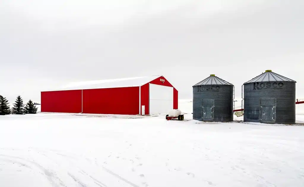 red post-frame machine shed by Integrity post structures