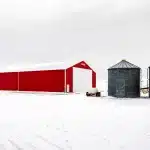 red post-frame machine shed by Integrity post structures