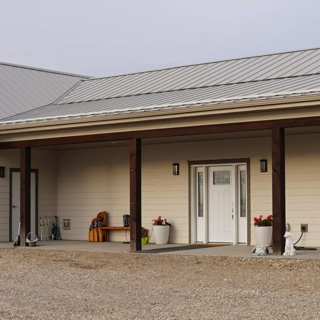 A galvanized post-frame highwood with garage