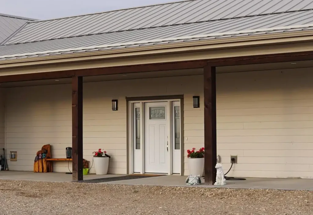 A post-frame highwood with garage residential build