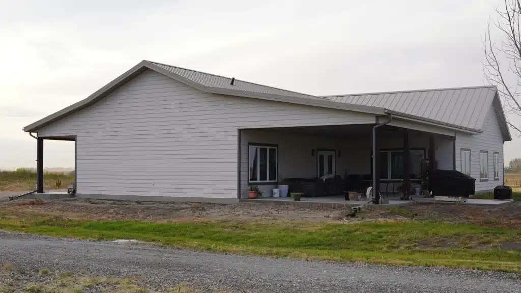 A post-frame highwood with garage residential build