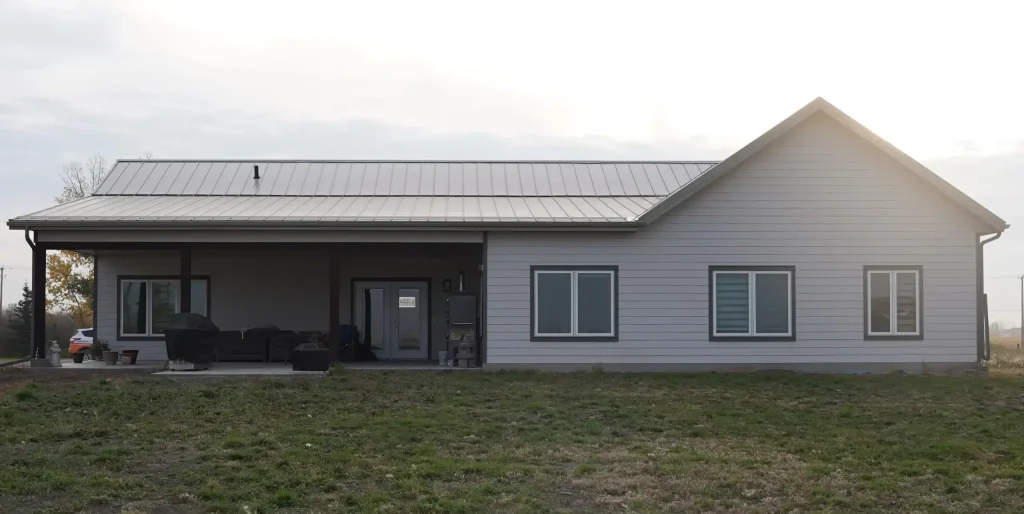 A post-frame highwood with garage residential build