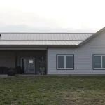 A post-frame highwood with garage residential build