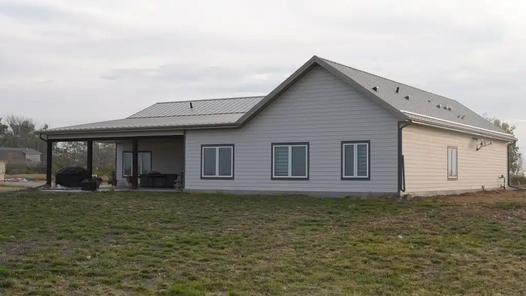 A galvanized post-frame highwood with garage