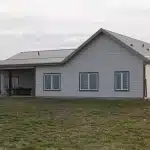 A galvanized post-frame highwood with garage