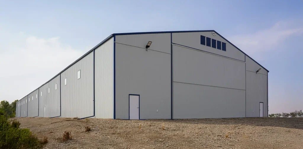 A Bone White post-frame agricultural storage building
