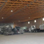 A Bone White post-frame agricultural storage building