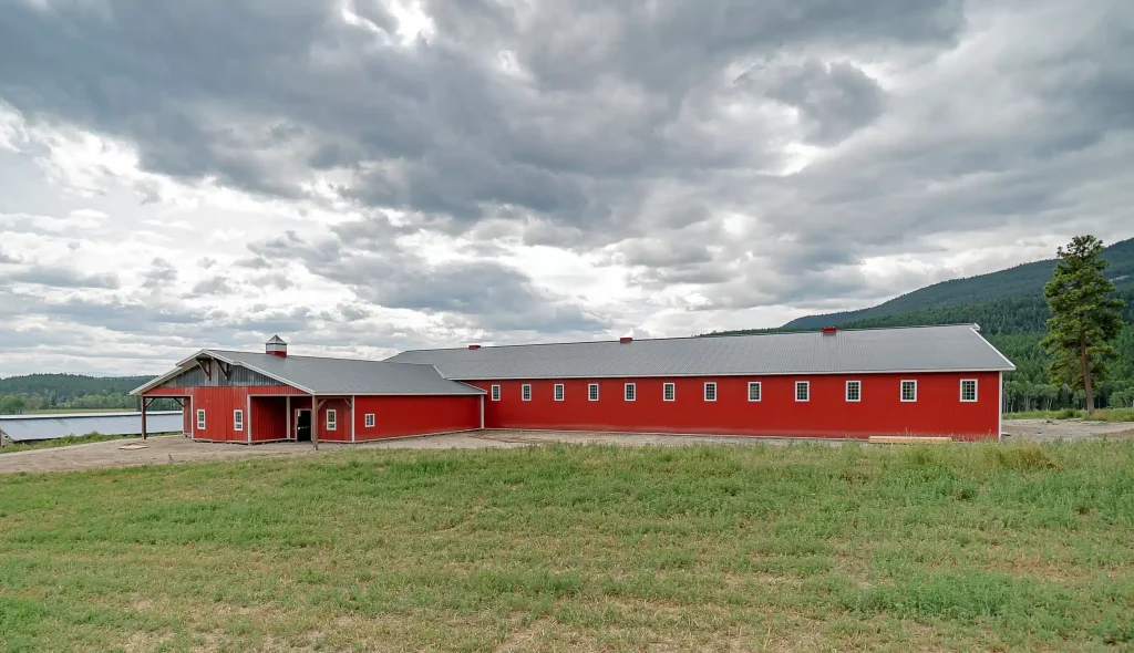 A post-frame equestrian riding arena