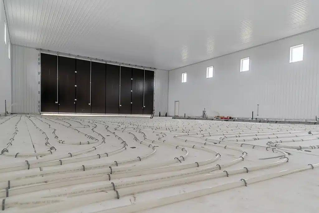 A buckskin post-frame agricultural storage building with findoors