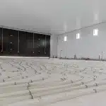 A buckskin post-frame agricultural storage building with findoors