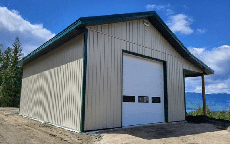 A wicker post-frame lifestyle & hobby shop with an overhead door, soffit, and open lean-to