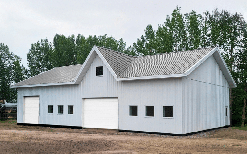 A bright white Lifestyle & Hobby shop with two overhead doors