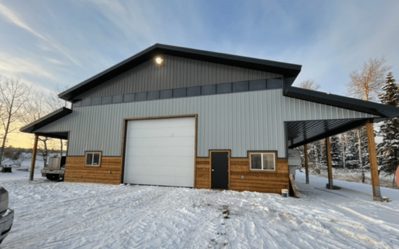 A buckskin post-frame lifestyle & hobby shop with open lean-tos, soffits, and wainscoting kick wall
