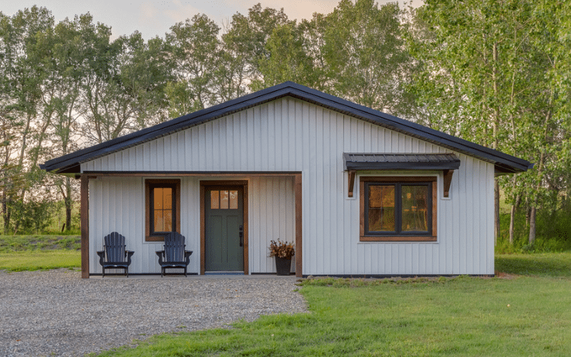 A white post-frame guest house