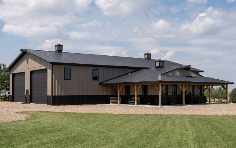 A buckskin post-frame lifestyle & hobby shop with soffits, overhead doors, cupolas, and wainscoting