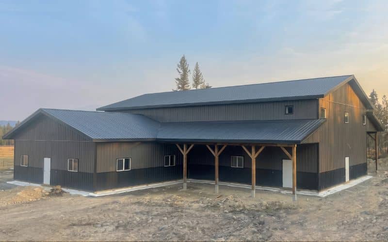 A charcoal post-frame lifestyle & hobby storage building with soffits and wainscotting