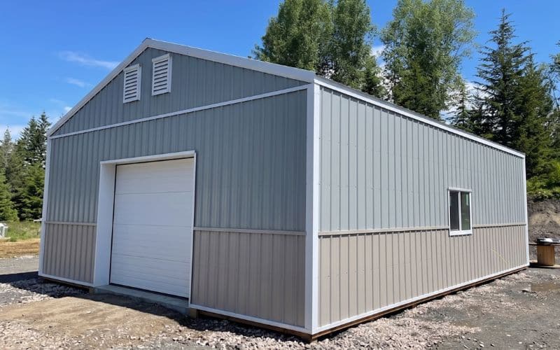 A regent grey post-frame lifestyle & hobby shop with stone grey wainscoting