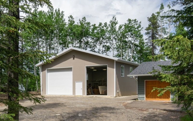 A sea wolf post-frame lifestyle & hobby shop with two overhead doors and soffits
