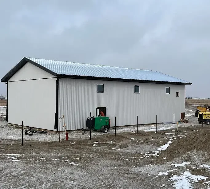 A white white post-frame lifestyle & hobby shop with premium wainscoting